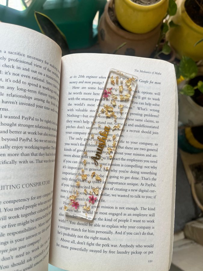 Clear resin bookmark with gold flakes and dried flowers