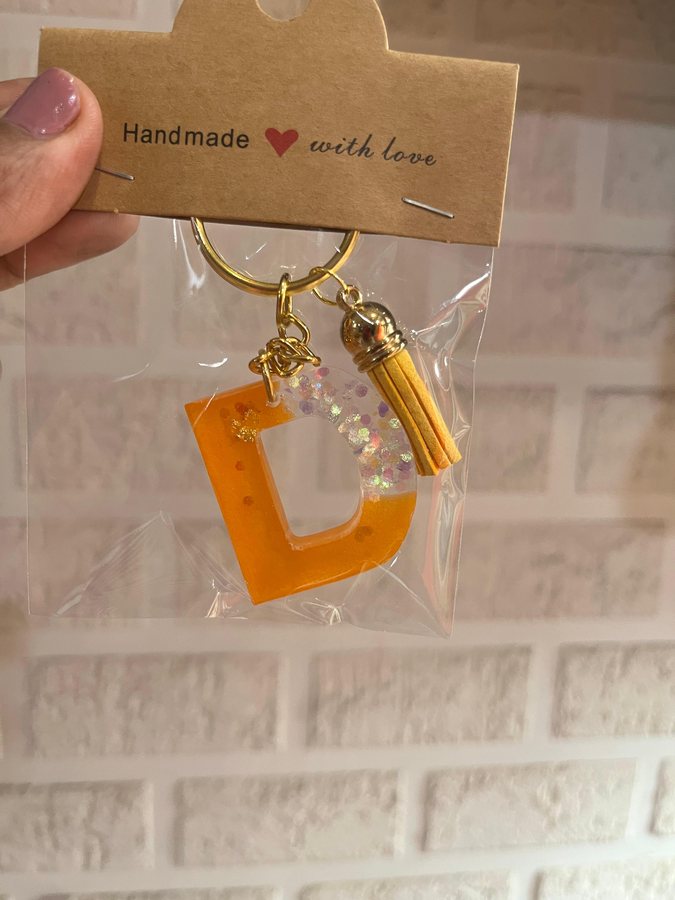 Orange resin keyring with orange tassel