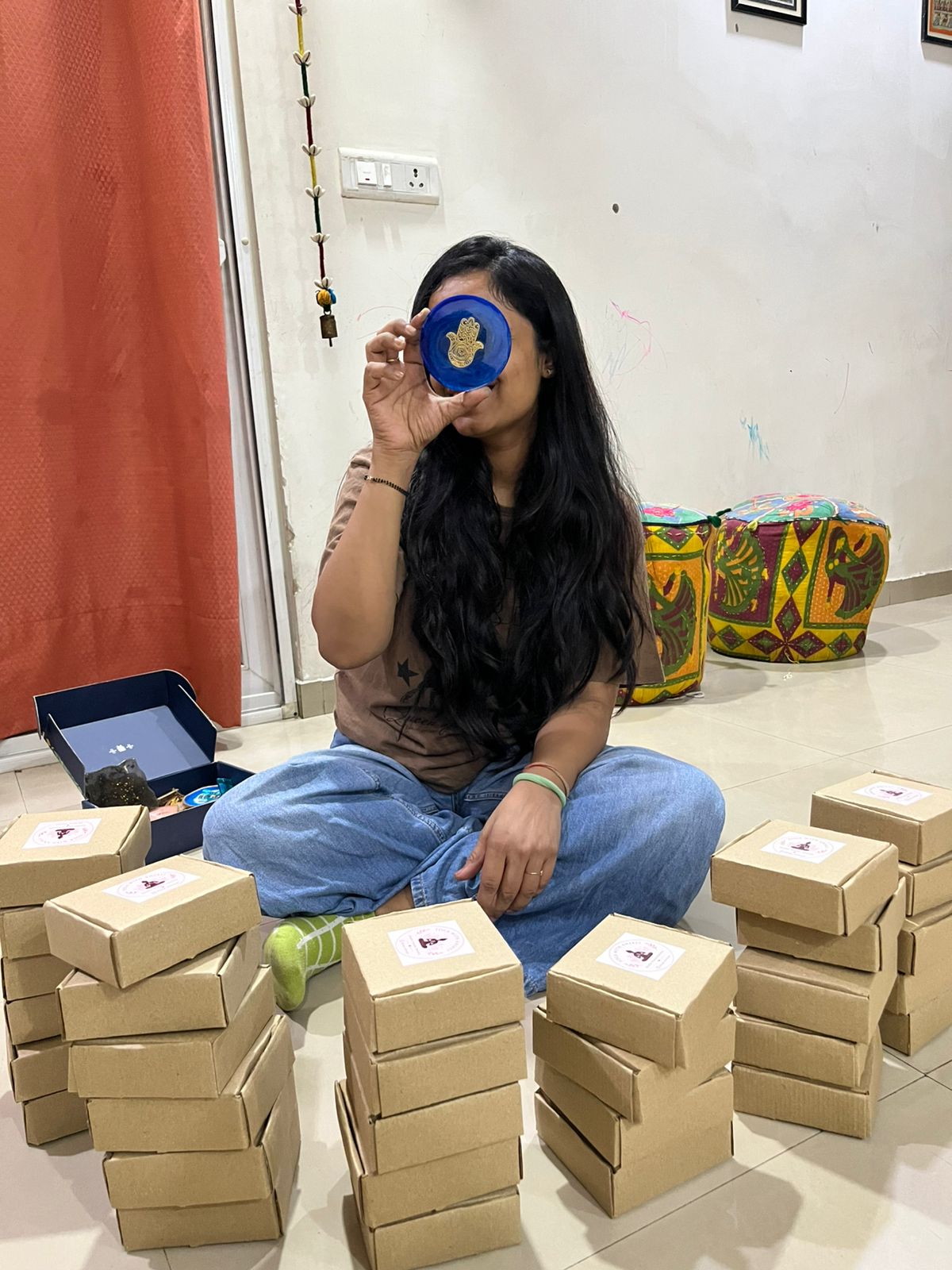 Prisha's mum surrounded by packed orders ready to ship