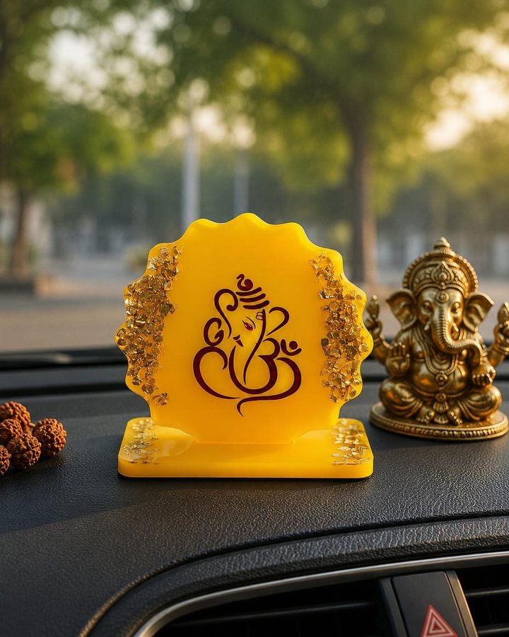 Yellow car dashboard Ganesha standee